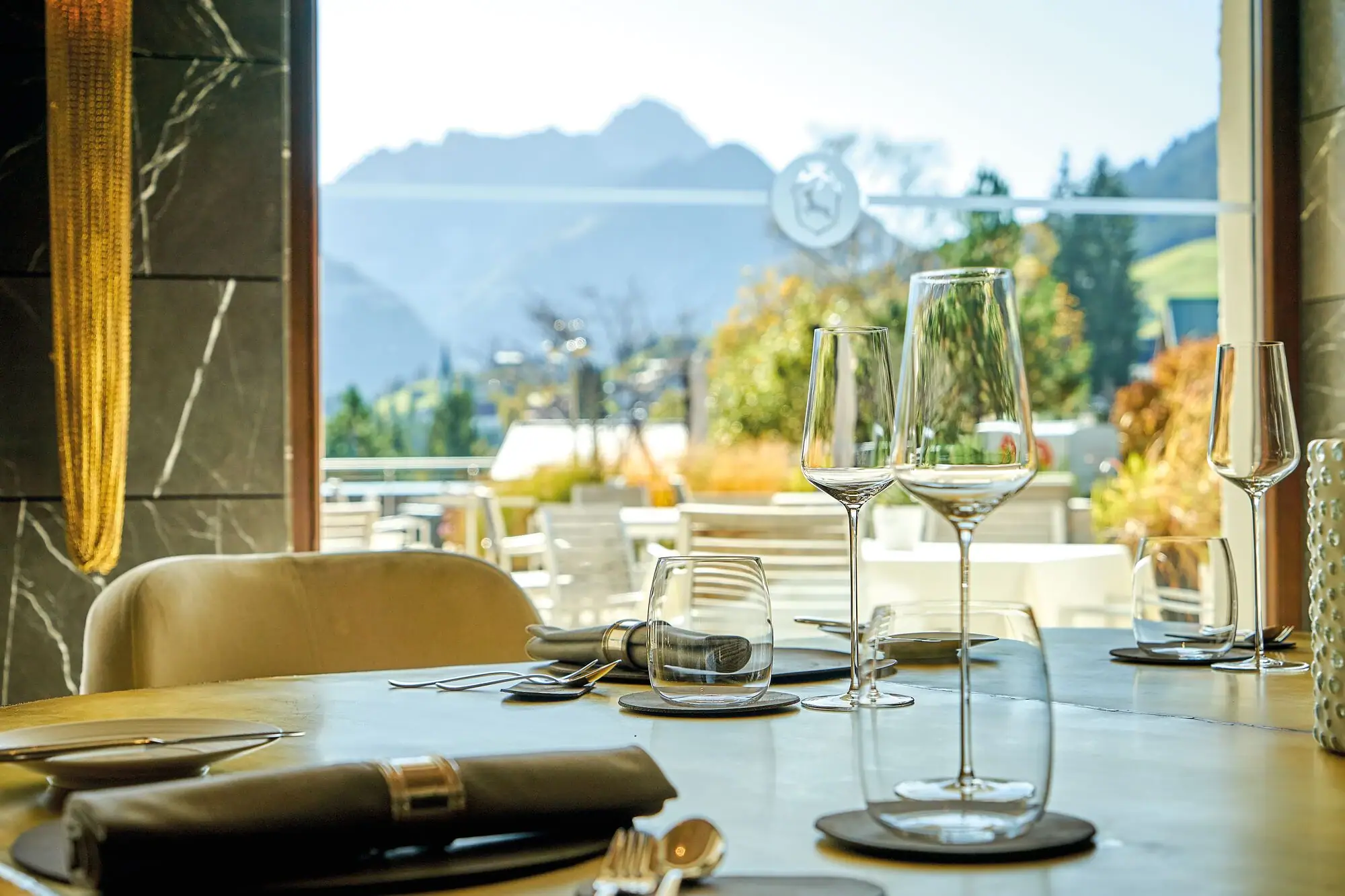 Kilian Stuba Restaurant A table with wine glasses and cutlery.