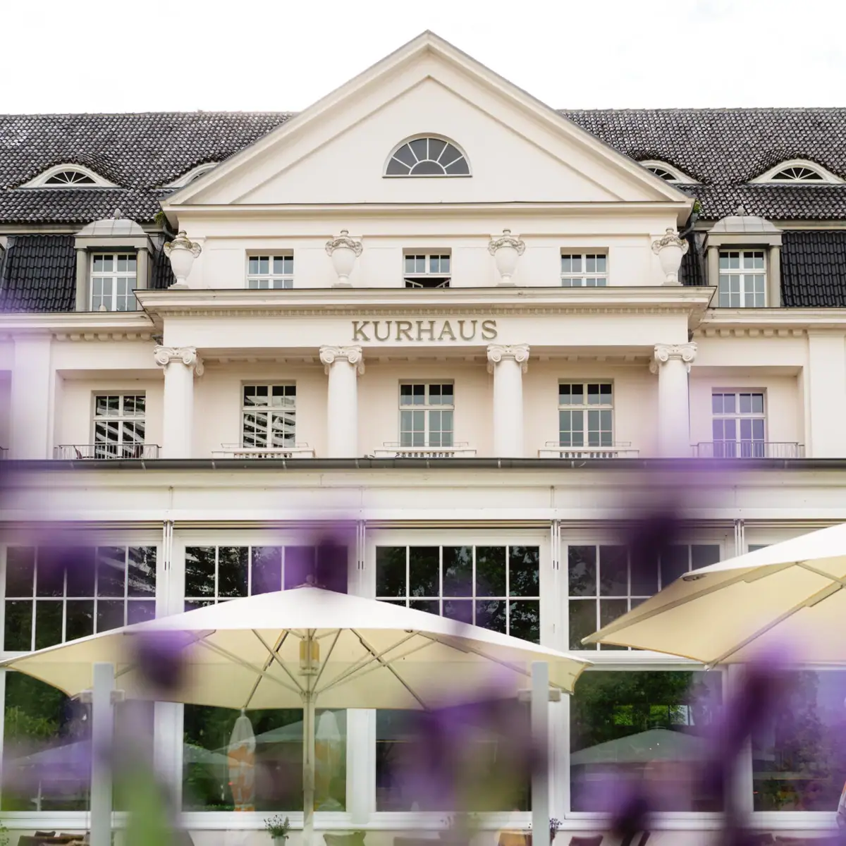 A building with a large window and a large umbrella.